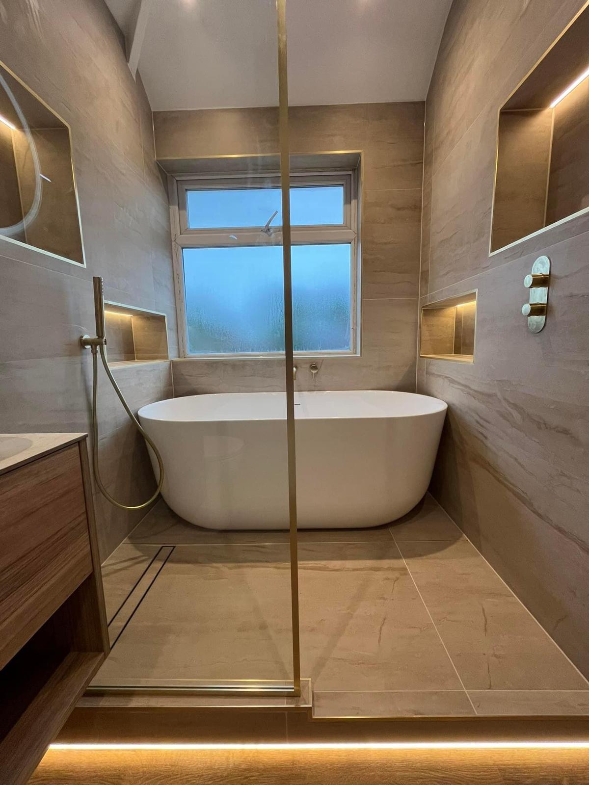 Custom bathroom tile installation with freestanding tub